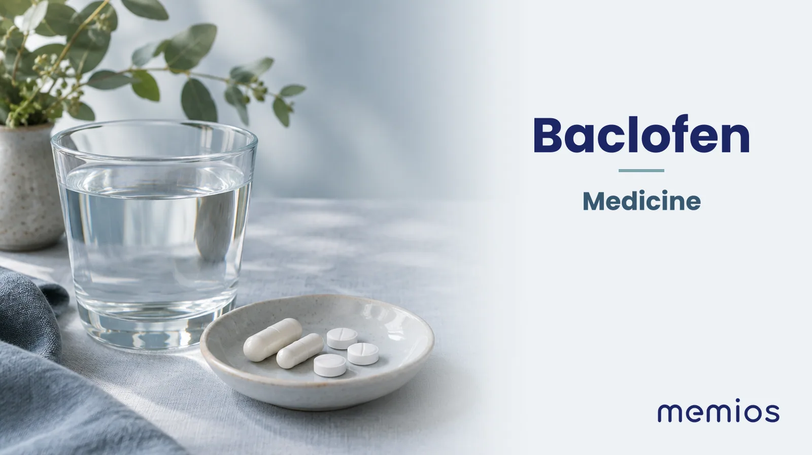Photograph for Baclofen: plain unmarked tablets in a dish beside a glass of water on pale linen.
