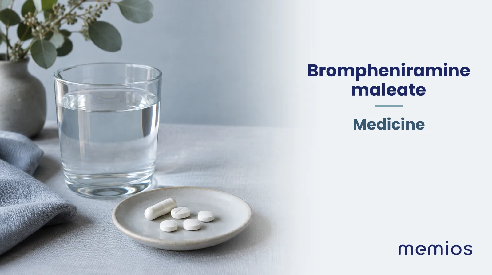 Photograph for Brompheniramine maleate: plain unmarked tablets in a dish beside a glass of water on pale linen.