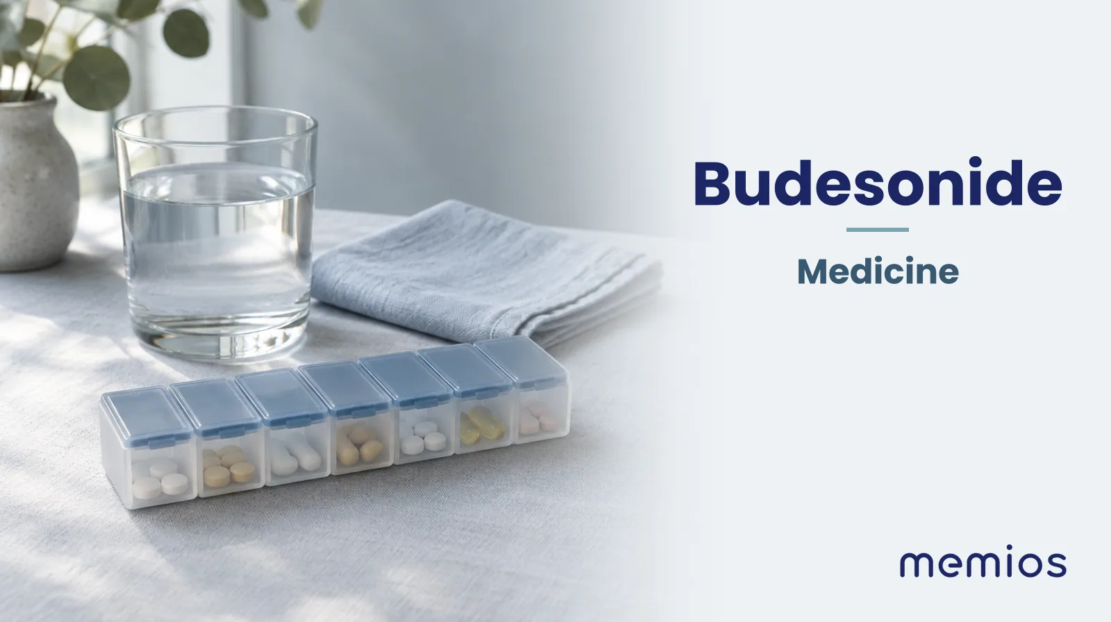 Photograph for Budesonide: plain unmarked tablets in a dish beside a glass of water on pale linen.