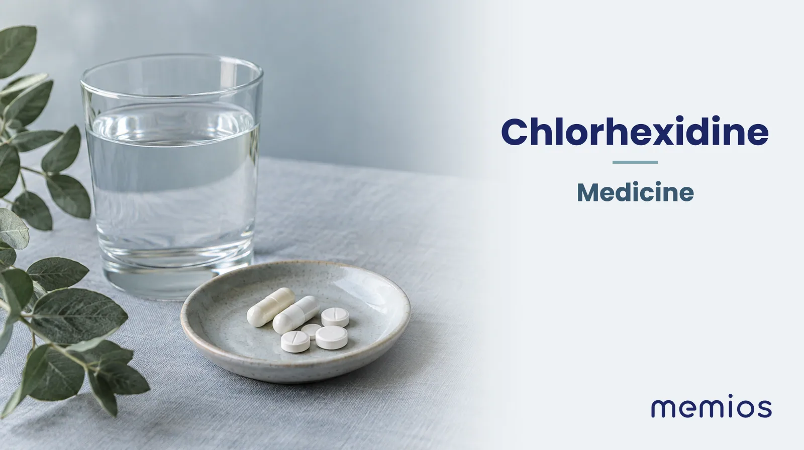 Photograph for Chlorhexidine: plain unmarked tablets in a dish beside a glass of water on pale linen.