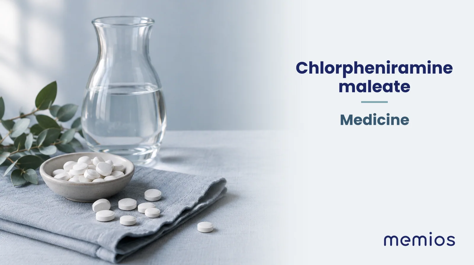Photograph for Chlorpheniramine maleate: plain unmarked tablets in a dish beside a glass of water on pale linen.