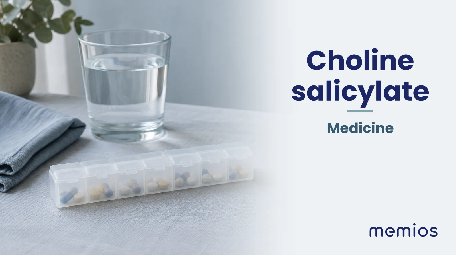 Photograph for Choline salicylate: plain unmarked tablets in a dish beside a glass of water on pale linen.
