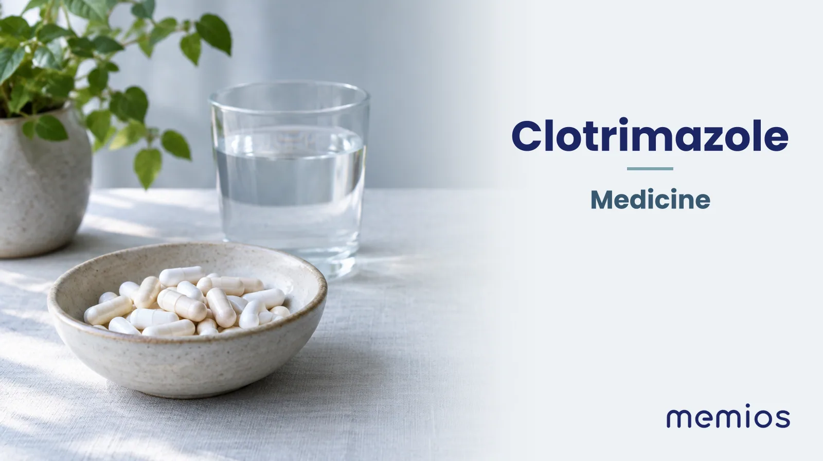 Photograph for Clotrimazole: plain unmarked tablets in a dish beside a glass of water on pale linen.