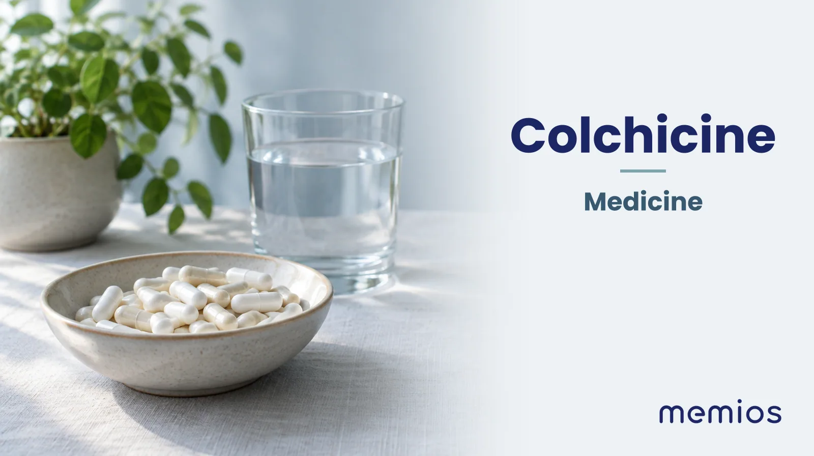 Photograph for Colchicine: plain unmarked tablets in a dish beside a glass of water on pale linen.