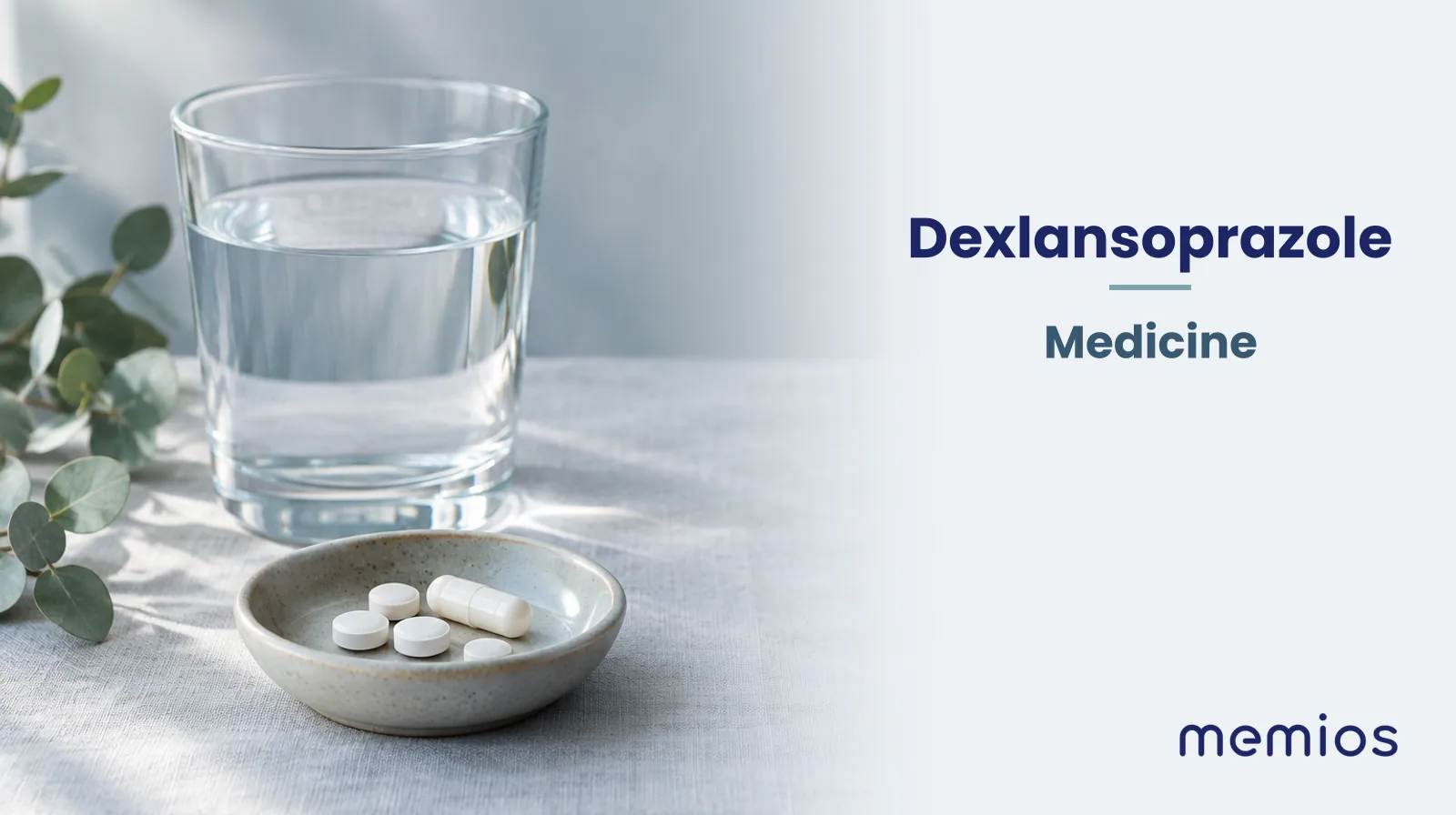 Photograph for Dexlansoprazole: plain unmarked tablets in a dish beside a glass of water on pale linen.