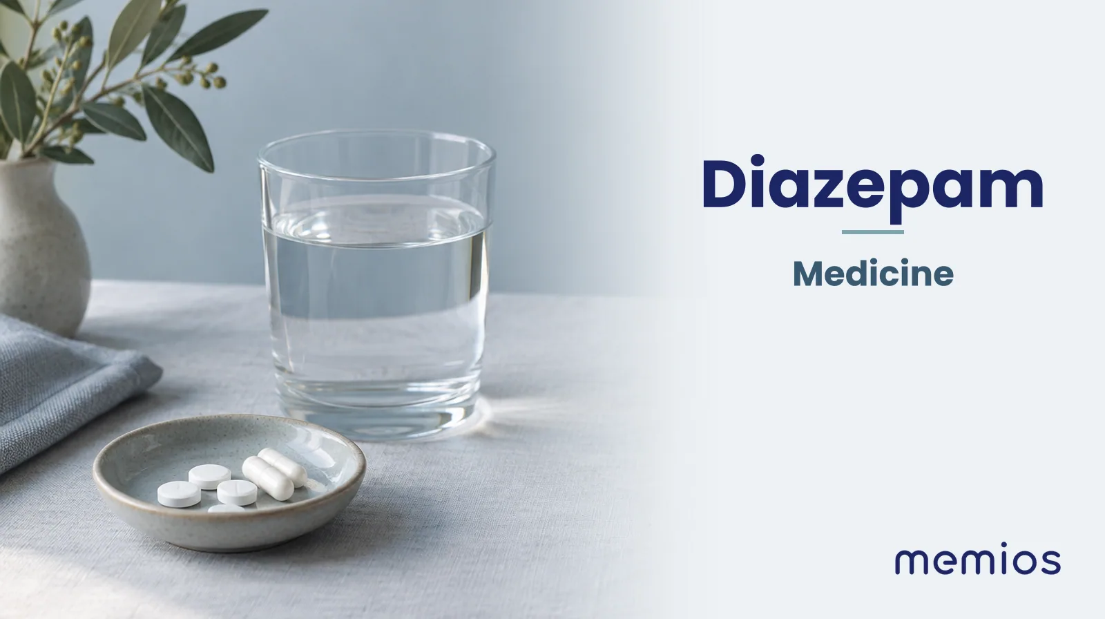 Photograph for Diazepam: plain unmarked tablets in a dish beside a glass of water on pale linen.