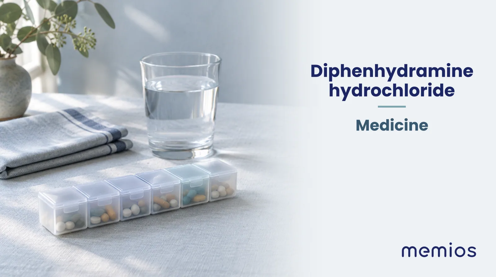 Photograph for Diphenhydramine hydrochloride: plain unmarked tablets in a dish beside a glass of water on pale linen.