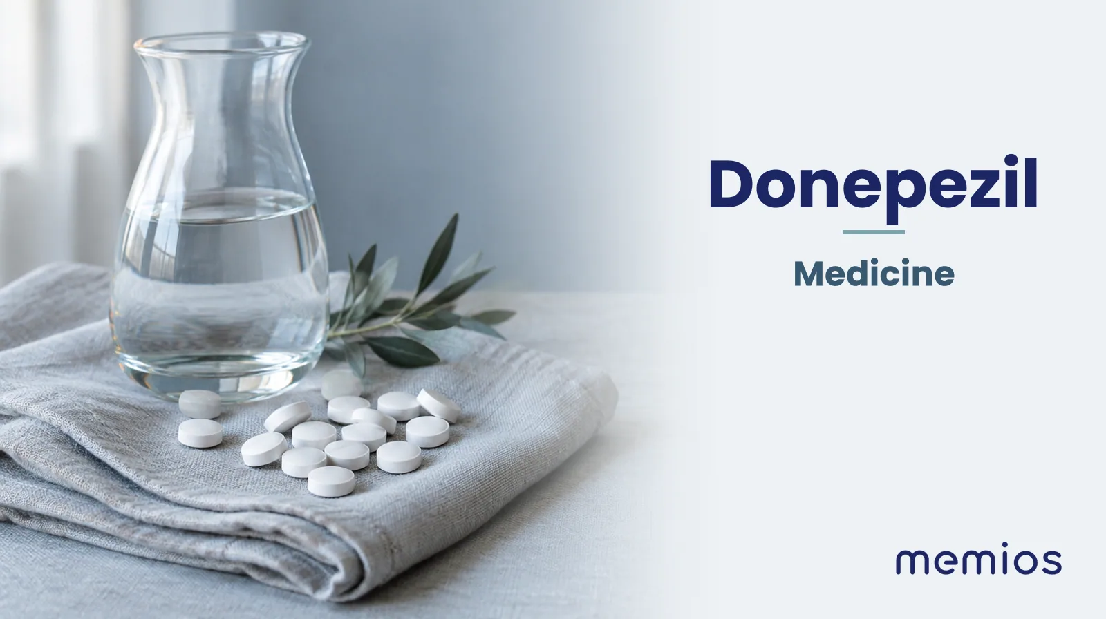 Photograph for Donepezil: plain unmarked tablets in a dish beside a glass of water on pale linen.