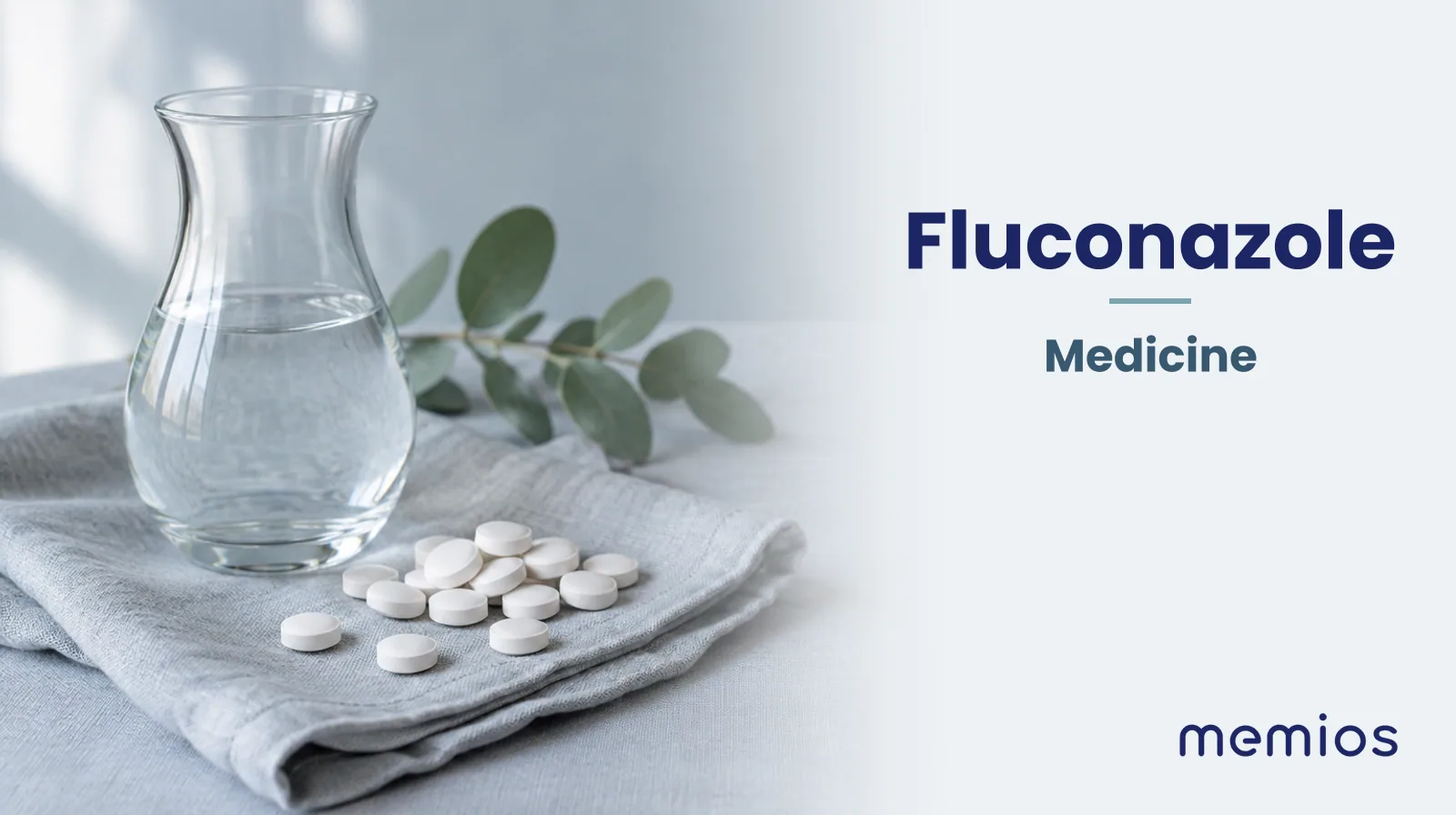 Photograph for Fluconazole: plain unmarked tablets in a dish beside a glass of water on pale linen.