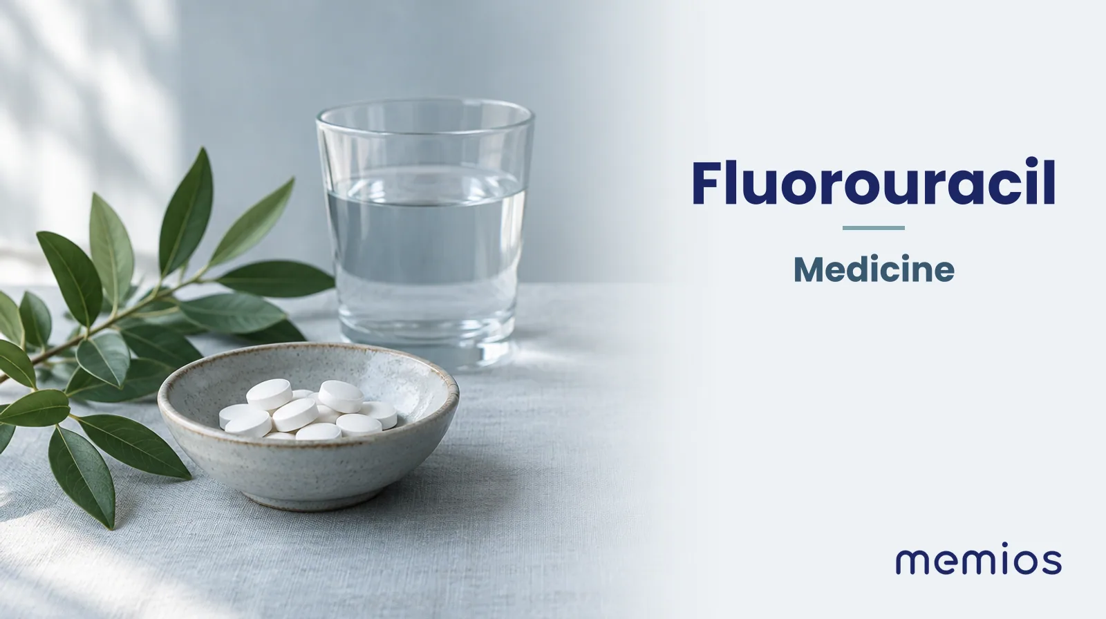 Photograph for Fluorouracil: plain unmarked tablets in a dish beside a glass of water on pale linen.