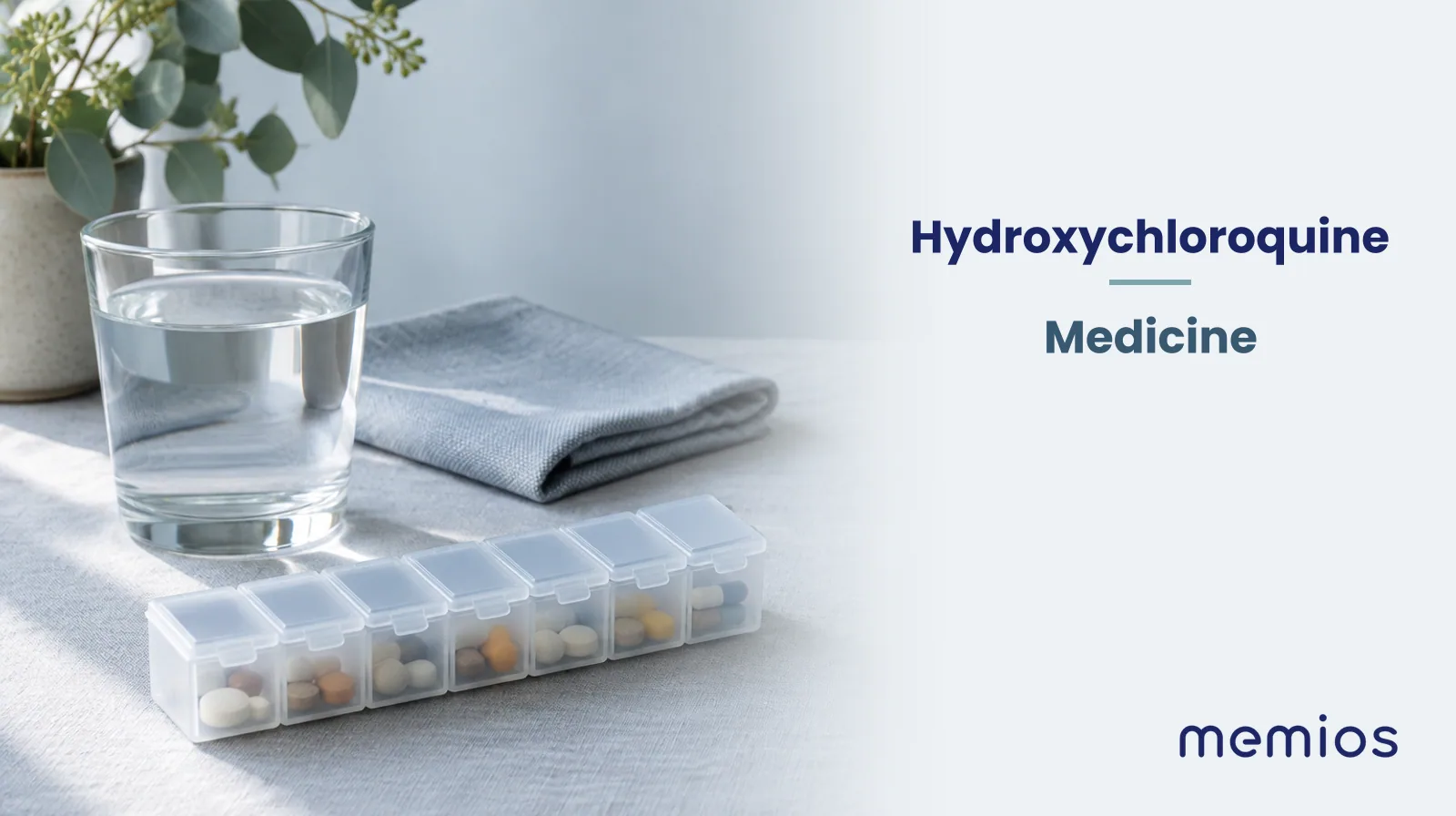 Photograph for Hydroxychloroquine: plain unmarked tablets in a dish beside a glass of water on pale linen.