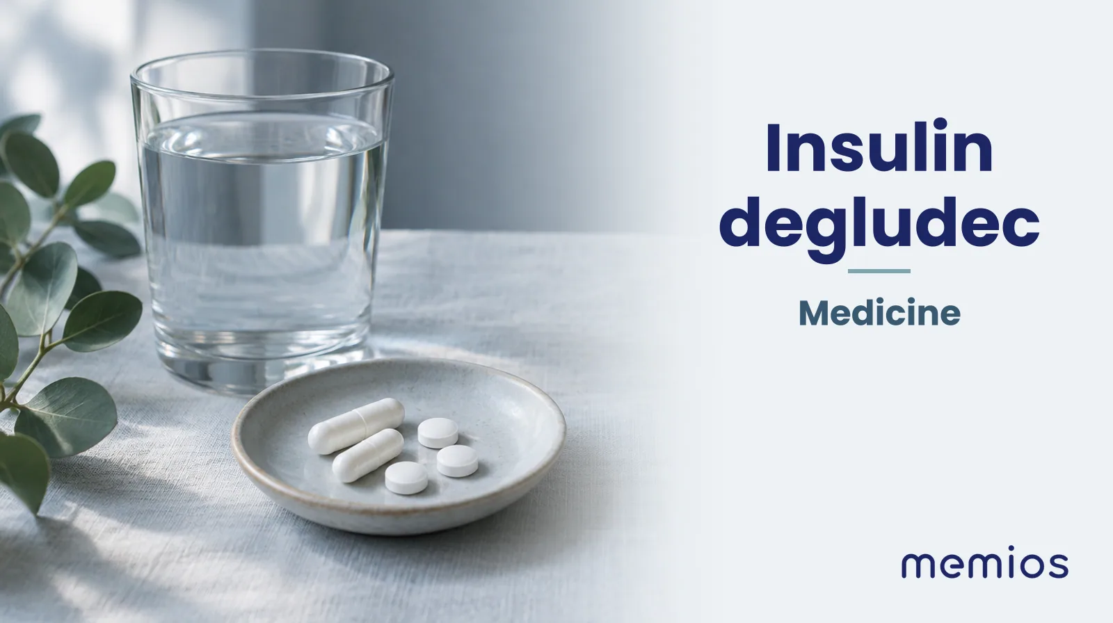 Photograph for Insulin degludec: plain unmarked tablets in a dish beside a glass of water on pale linen.