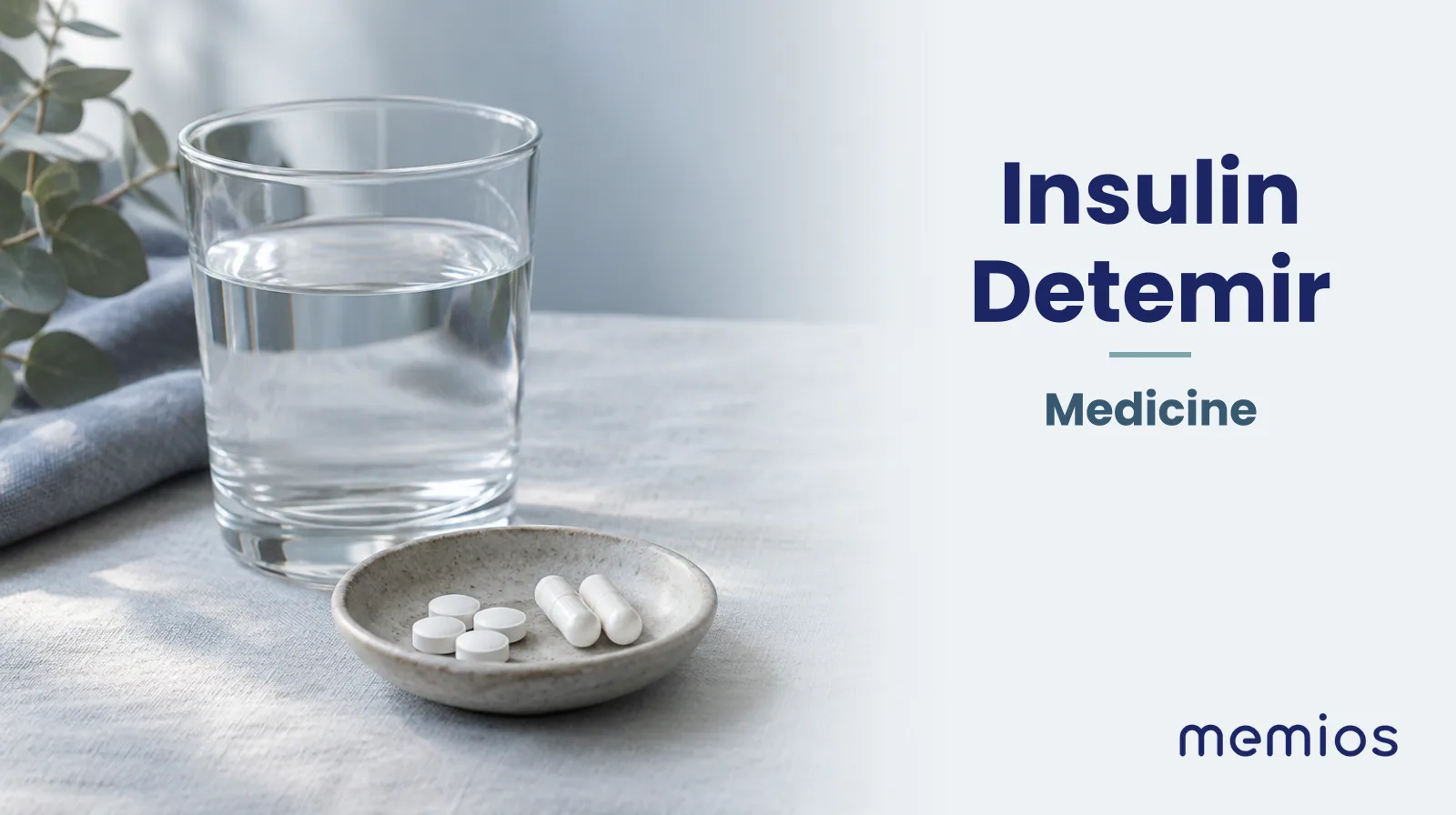 Photograph for Insulin Detemir: plain unmarked tablets in a dish beside a glass of water on pale linen.