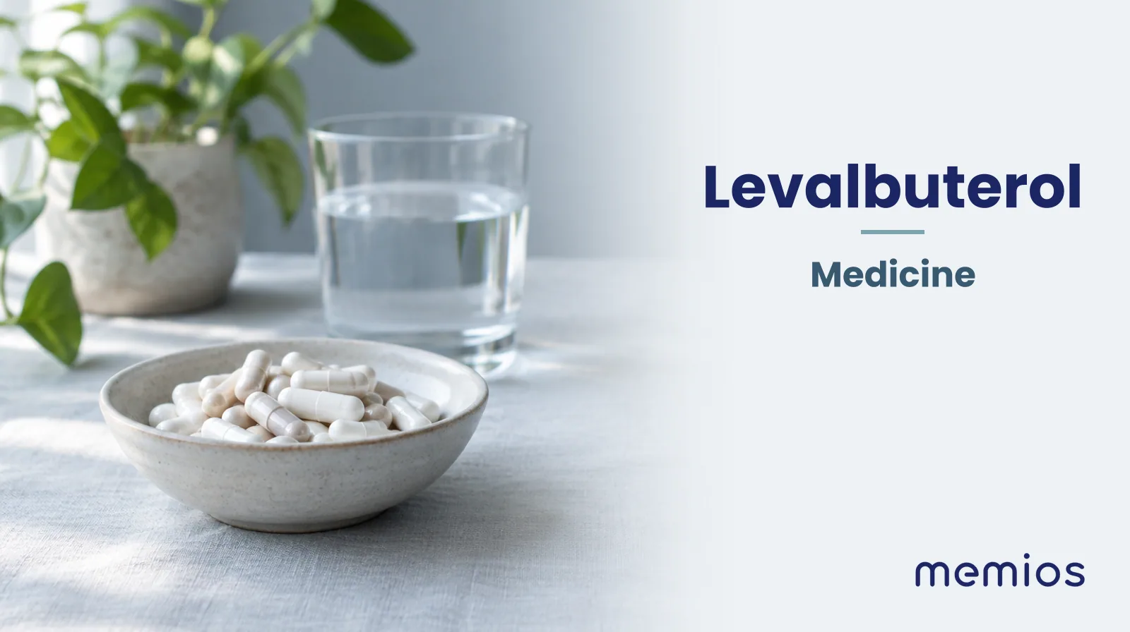 Photograph for Levalbuterol: plain unmarked tablets in a dish beside a glass of water on pale linen.