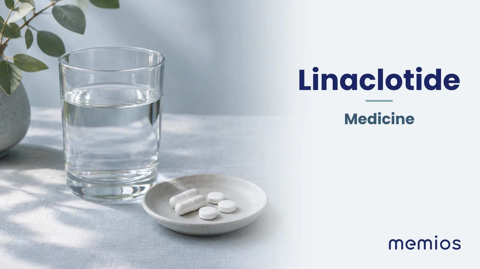 Photograph for Linaclotide: plain unmarked tablets in a dish beside a glass of water on pale linen.