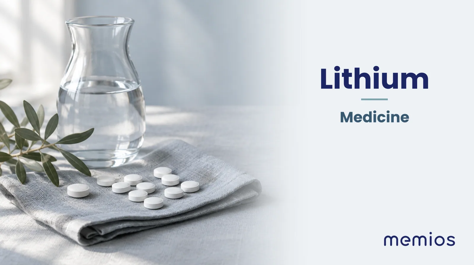 Photograph for Lithium: plain unmarked tablets in a dish beside a glass of water on pale linen.