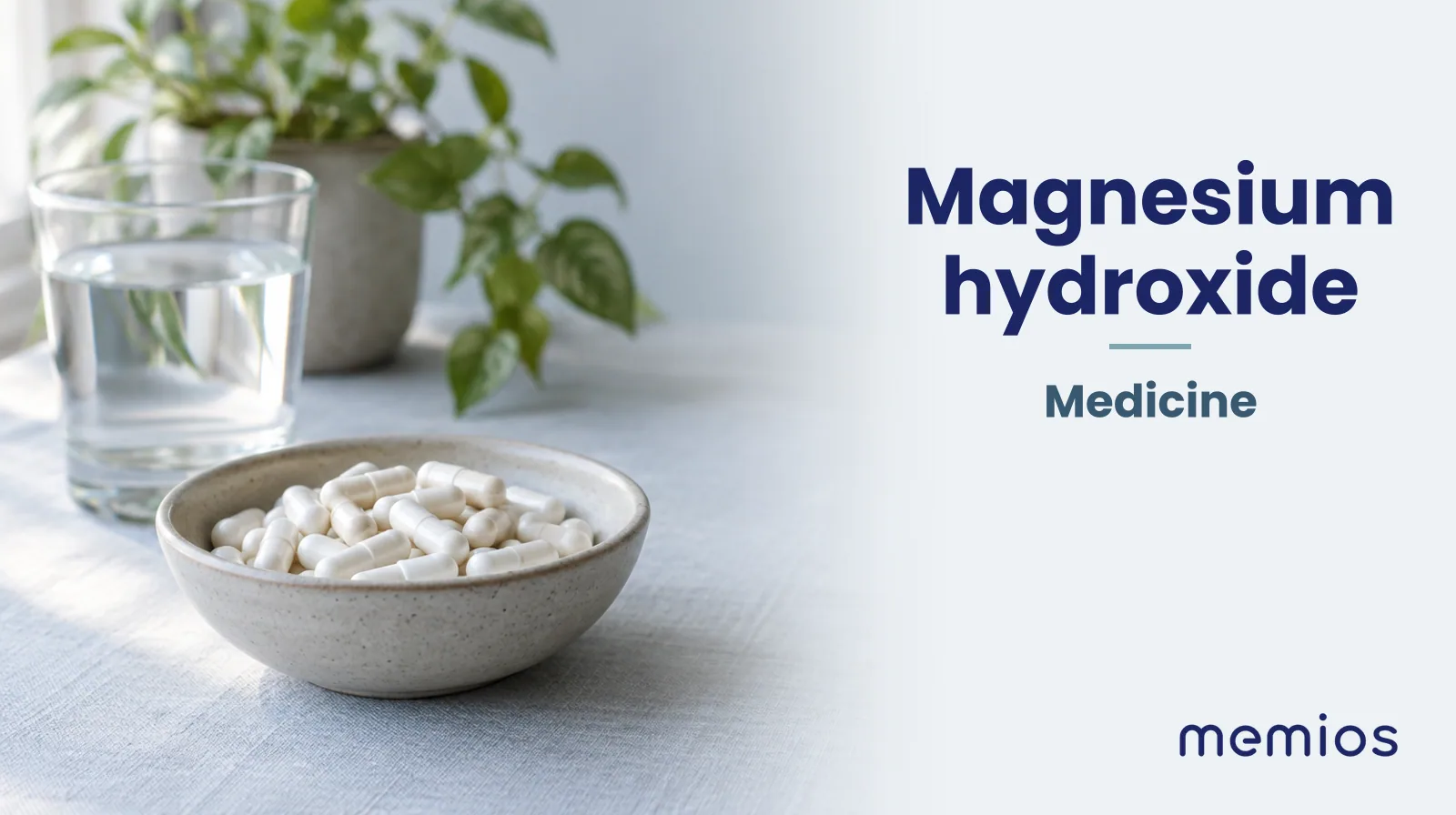 Photograph for Magnesium hydroxide: plain unmarked tablets in a dish beside a glass of water on pale linen.