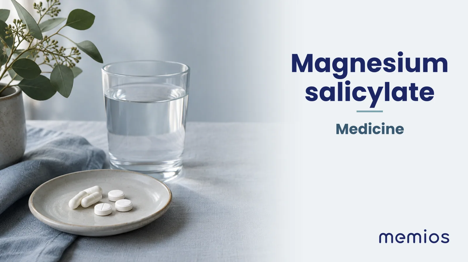 Photograph for Magnesium salicylate: plain unmarked tablets in a dish beside a glass of water on pale linen.