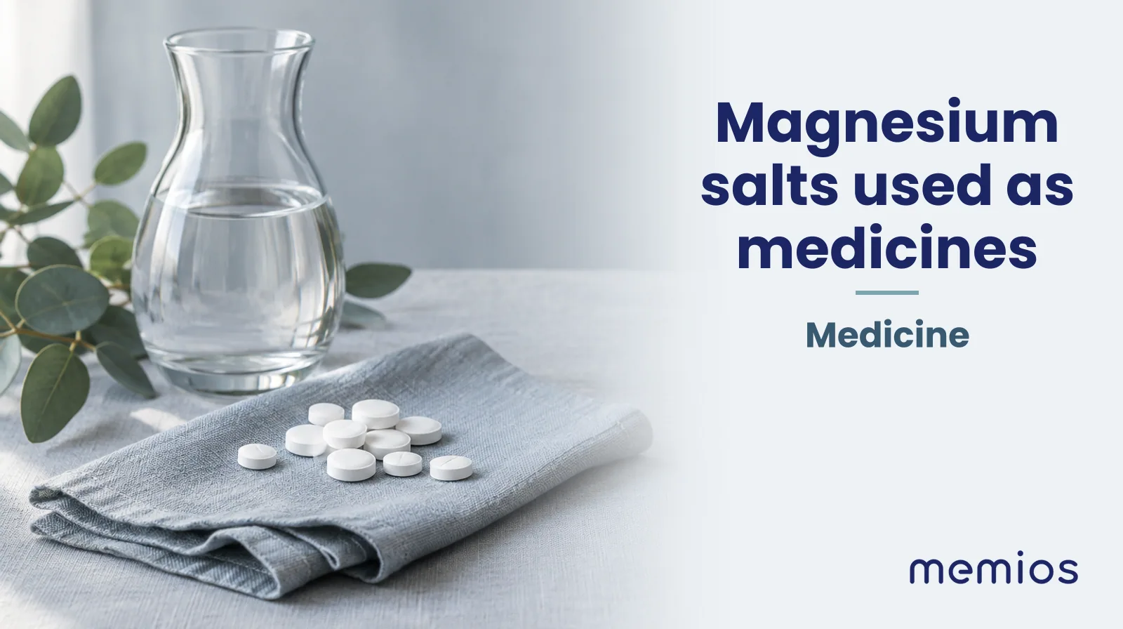Photograph for Magnesium salts used as medicines: plain unmarked tablets in a dish beside a glass of water on pale linen.