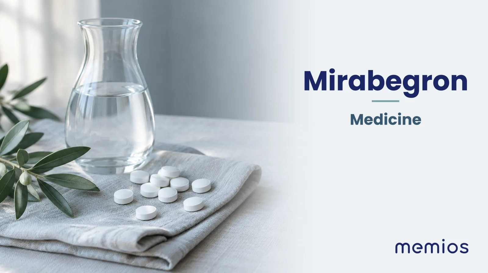 Photograph for Mirabegron: plain unmarked tablets in a dish beside a glass of water on pale linen.