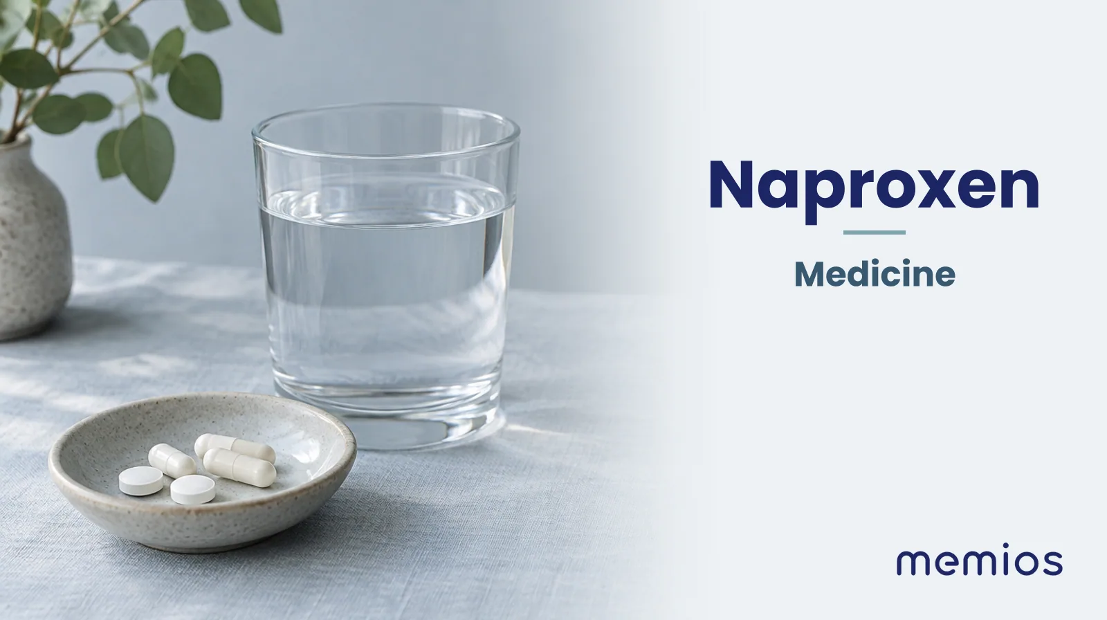 Photograph for Naproxen: plain unmarked tablets in a dish beside a glass of water on pale linen.