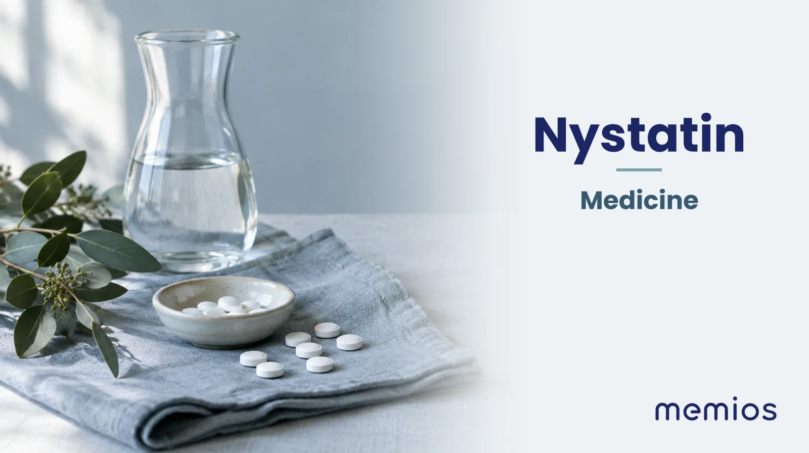 Photograph for Nystatin: plain unmarked tablets in a dish beside a glass of water on pale linen.