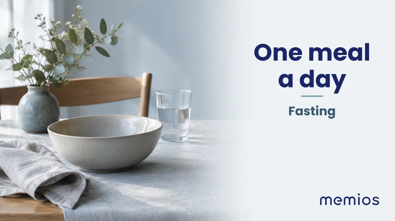 Photograph for One meal a day: a calm table with an empty plate and a glass of water in morning light.