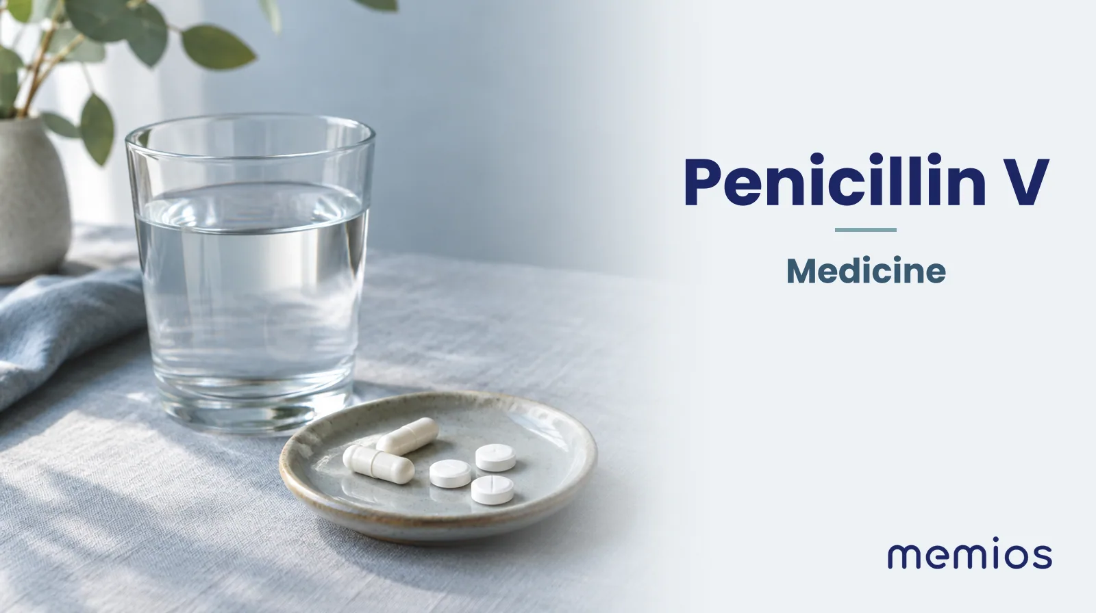 Photograph for Penicillin V: plain unmarked tablets in a dish beside a glass of water on pale linen.