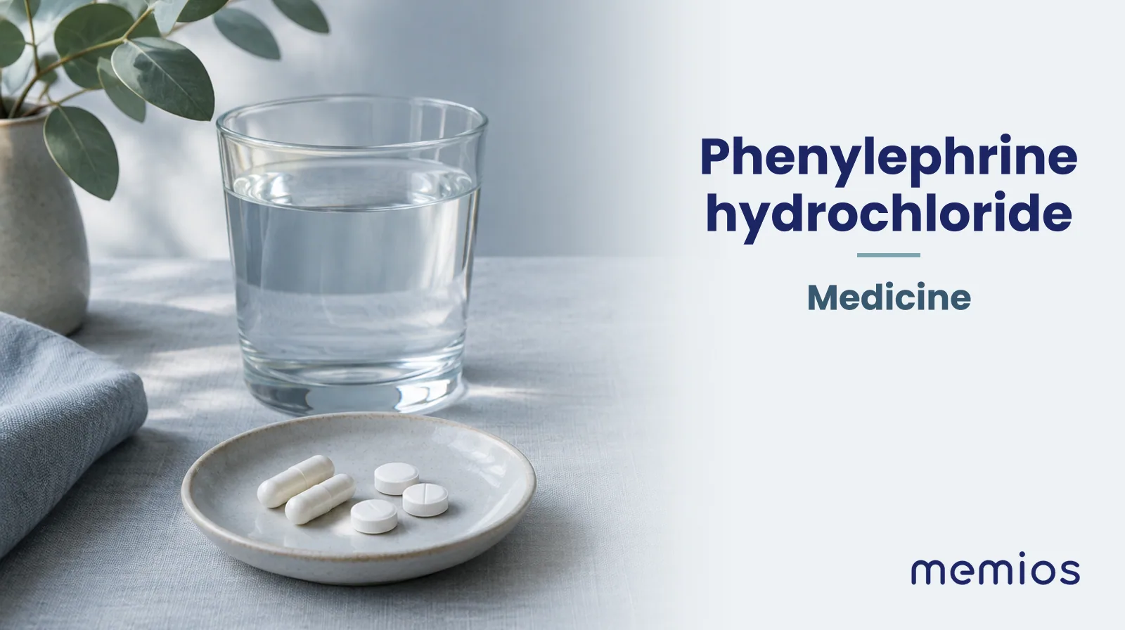 Photograph for Phenylephrine hydrochloride: plain unmarked tablets in a dish beside a glass of water on pale linen.