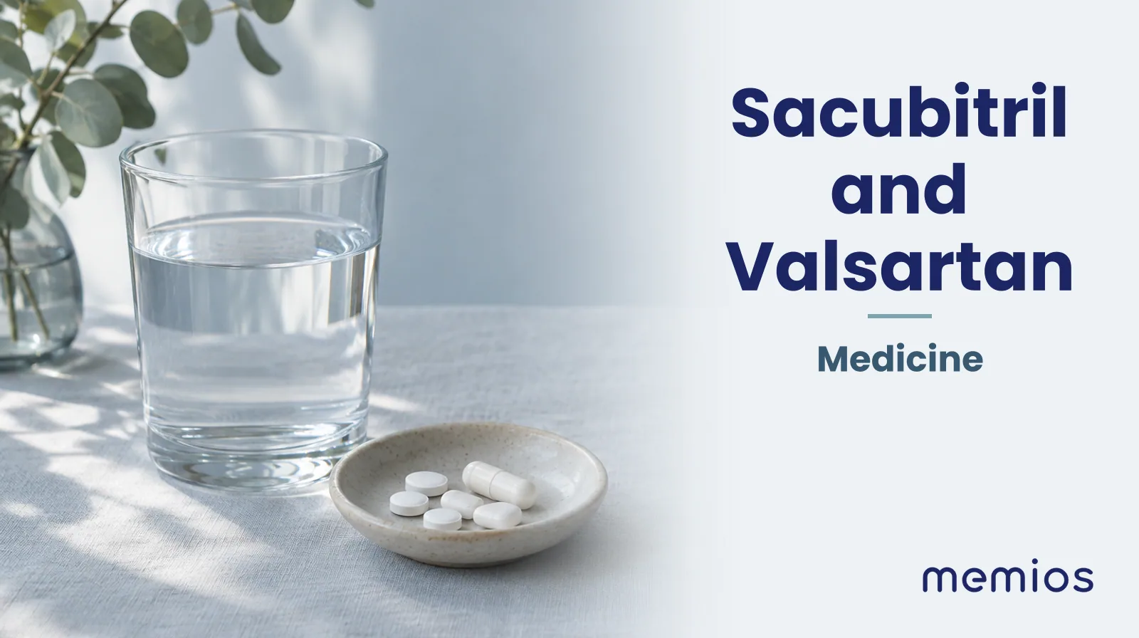 Photograph for Sacubitril and Valsartan: plain unmarked tablets in a dish beside a glass of water on pale linen.
