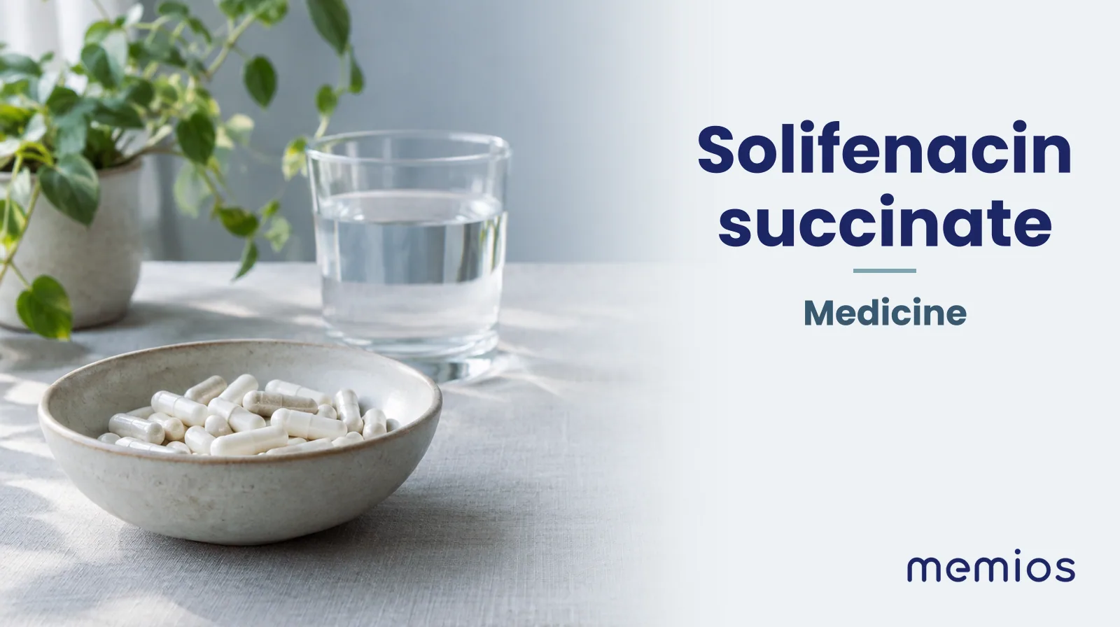 Photograph for Solifenacin succinate: plain unmarked tablets in a dish beside a glass of water on pale linen.