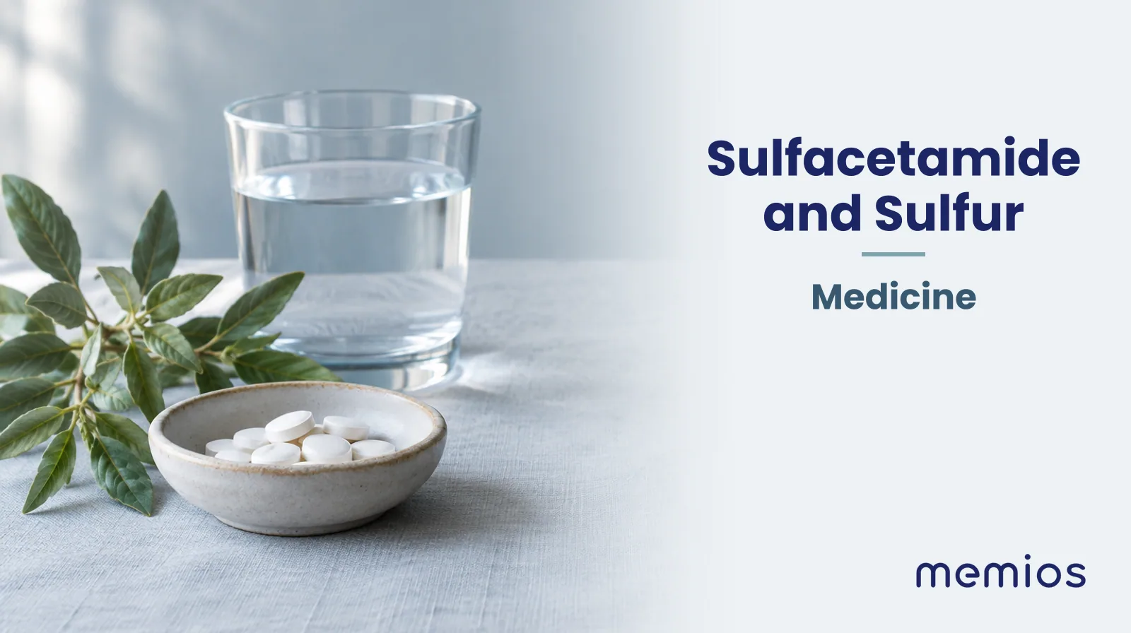 Photograph for Sulfacetamide and Sulfur: plain unmarked tablets in a dish beside a glass of water on pale linen.