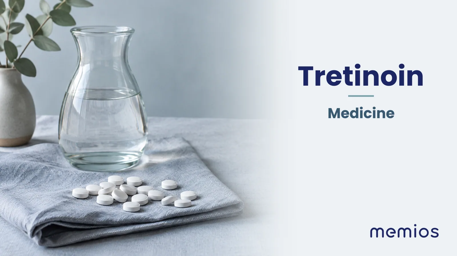 Photograph for Tretinoin: plain unmarked tablets in a dish beside a glass of water on pale linen.